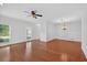 Inviting living area with gleaming hardwood floors, recessed lighting, and a classic chandelier at 2000 Stockton Walk Ln, Snellville, GA 30078