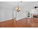 Spacious living room features hardwood floors, fireplace, and elegant lighting at 2000 Stockton Walk Ln, Snellville, GA 30078