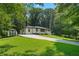 View of the home from the driveway showcasing its backyard storage building at 4291 Lamar Street St, Decatur, GA 30035