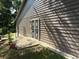 Side view of back porch area leading to fenced yard, potted plants adorn the area at 8113 Fieldstream Way, Douglasville, GA 30134