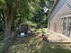 Spacious backyard featuring a storage shed, patio, and a well-maintained lawn at 8113 Fieldstream Way, Douglasville, GA 30134