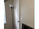 Bedroom featuring a clean white door with gold hardware and a modern floor lamp at 8113 Fieldstream Way, Douglasville, GA 30134