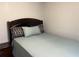 This is a cozy bedroom with a nice bed, a headboard, and a side table at 8113 Fieldstream Way, Douglasville, GA 30134