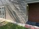 Side exterior view showing fenced yard, security door and entrance to the home at 8113 Fieldstream Way, Douglasville, GA 30134