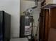 The photo captures a water heater setup at 8113 Fieldstream Way, Douglasville, GA 30134