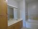 This bathroom offers a double sink with cabinet space and a shower-tub combination at 870 Mayson Turner Nw Rd # 1344, Atlanta, GA 30314
