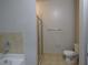 The bathroom showcases a bathtub, glass shower and beige tile accents at 870 Mayson Turner Nw Rd # 1344, Atlanta, GA 30314