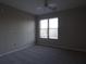 Simple bedroom with gray carpeting, a ceiling fan, and a window with blinds at 870 Mayson Turner Nw Rd # 1344, Atlanta, GA 30314