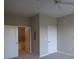 Neutral bedroom features carpet, a ceiling fan, a double door closet and an attached bathroom at 870 Mayson Turner Nw Rd # 1344, Atlanta, GA 30314
