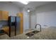 Kitchen featuring granite countertops, stainless steel appliances, and white cabinetry at 870 Mayson Turner Nw Rd # 1344, Atlanta, GA 30314