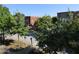 Street view lined with trees in front of brick buildings on a sunny day at 870 Mayson Turner Nw Rd # 1344, Atlanta, GA 30314