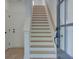 Bright stairway features light wood treads and white risers leading to the upper level at 1915 Deco Dr, Kennesaw, GA 30144