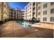 Community pool with a sundeck surrounded by multi-story condo buildings in a well-maintained complex at 870 Mayson Turner Nw Rd # 1228, Atlanta, GA 30314