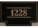 Close-up of unit number 1228 sign with gold numbers at 870 Mayson Turner Nw Rd # 1228, Atlanta, GA 30314