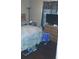 Cozy bedroom with dark floors, dresser, TV, and decorative curtains at 1566 Avon Sw Ave, Atlanta, GA 30311
