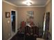 A cozy dining room with classic accents, seating for six, and natural light creates an inviting space at 1566 Avon Sw Ave, Atlanta, GA 30311
