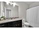 Well-lit bathroom with granite countertops, modern fixtures, and vanity at 2638 Village Park Bnd, Duluth, GA 30096