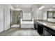 Bathroom features a soaking tub, walk-in shower and double sinks at 2638 Village Park Bnd, Duluth, GA 30096