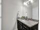 Bathroom featuring a granite vanity countertop and modern fixtures at 2638 Village Park Bnd, Duluth, GA 30096