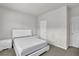 This bedroom has a simple bed and two nightstands, painted in neutral tones at 2638 Village Park Bnd, Duluth, GA 30096