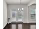 Dining area featuring hardwood floors and double glass doors for ample natural light at 2638 Village Park Bnd, Duluth, GA 30096