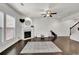 Bright living room with a fireplace, hardwood flooring, and neutral decor at 2638 Village Park Bnd, Duluth, GA 30096