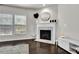 Comfortable living room with a fireplace and natural light from the large windows at 2638 Village Park Bnd, Duluth, GA 30096