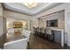 Well-appointed amenity room with a wet bar, dining table, and modern fixtures at 3475 Oak Valley Ne Rd # 910, Atlanta, GA 30326