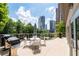Spacious balcony with outdoor seating and views of the Atlanta skyline at 3475 Oak Valley Ne Rd # 910, Atlanta, GA 30326