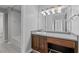 A stylish bathroom features a vanity with wood cabinets at 3475 Oak Valley Ne Rd # 910, Atlanta, GA 30326