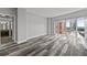 Bright bedroom with hardwood floors, featuring an ensuite bathroom and large windows offering cityscape views at 3475 Oak Valley Ne Rd # 910, Atlanta, GA 30326