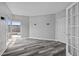 Comfortable bedroom with hardwood floors and ample natural light from large windows at 3475 Oak Valley Ne Rd # 910, Atlanta, GA 30326