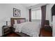Comfortable bedroom featuring a bed, bedside tables, and a window with curtains at 3475 Oak Valley Ne Rd # 910, Atlanta, GA 30326