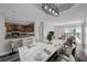 Virtual staging of a dining room area, showcasing eat-in kitchen, hardwood floors and an open concept to the living room at 3475 Oak Valley Ne Rd # 910, Atlanta, GA 30326