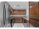 This kitchen has beautiful wood cabinets and modern stainless steel appliances at 3475 Oak Valley Ne Rd # 910, Atlanta, GA 30326