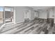 Spacious living room features hardwood floors, neutral paint, and large windows with a cityscape view at 3475 Oak Valley Ne Rd # 910, Atlanta, GA 30326
