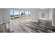 Bright living room with floor-to-ceiling windows providing abundant natural light and city views, along with hardwood floors at 3475 Oak Valley Ne Rd # 910, Atlanta, GA 30326