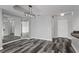 Elegant living room showcases hardwood floors, modern lighting, and mirrors for added depth at 3475 Oak Valley Ne Rd # 910, Atlanta, GA 30326