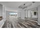 Bright living room featuring hardwood floors, recessed lighting, and floor-to-ceiling windows with scenic views at 3475 Oak Valley Ne Rd # 910, Atlanta, GA 30326