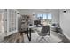 Bright home office offers large windows, stylish wood floors, and modern fixtures at 3475 Oak Valley Ne Rd # 910, Atlanta, GA 30326