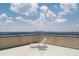 Relaxing rooftop deck with a lounge chair and city skyline views at 3475 Oak Valley Ne Rd # 910, Atlanta, GA 30326