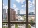 City view through a large picture window with a blue sky background at 3475 Oak Valley Ne Rd # 910, Atlanta, GA 30326