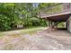 Spacious backyard featuring a patio area, a small storage shed, and an upper level deck with stairs to the yard at 3999 Phils Ct, Tucker, GA 30084