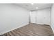 Spacious bedroom featuring a neutral color scheme, wood-look floors, and two closets at 3999 Phils Ct, Tucker, GA 30084