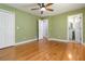 Open bedroom featuring hardwood flooring, and access to the bathroom at 3999 Phils Ct, Tucker, GA 30084