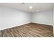 This bedroom features attractive wood-look flooring and neutral paint at 3999 Phils Ct, Tucker, GA 30084