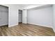Bedroom featuring wood-look floors and multiple closets for ample storage space at 3999 Phils Ct, Tucker, GA 30084