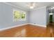 Bedroom with hardwood flooring, natural light, and neutral color scheme at 3999 Phils Ct, Tucker, GA 30084