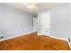 Bedroom with hardwood flooring, a ceiling fan, and a white door at 3999 Phils Ct, Tucker, GA 30084