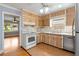 Efficient kitchen with stainless steel appliances and ample cabinet space for storage at 3999 Phils Ct, Tucker, GA 30084